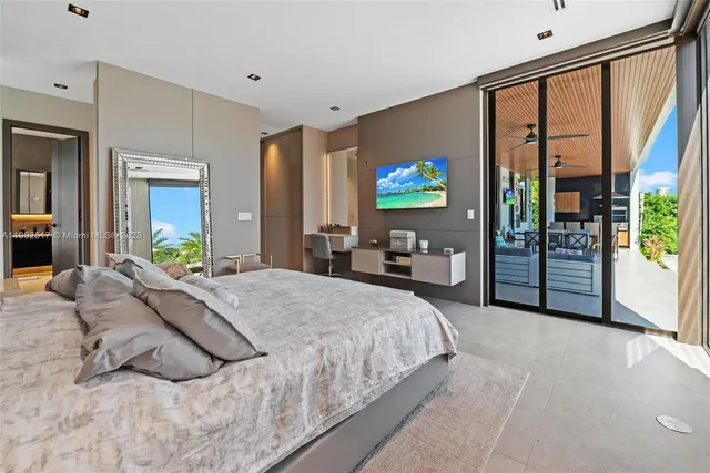 a spacious bedroom with a bed and a dresser