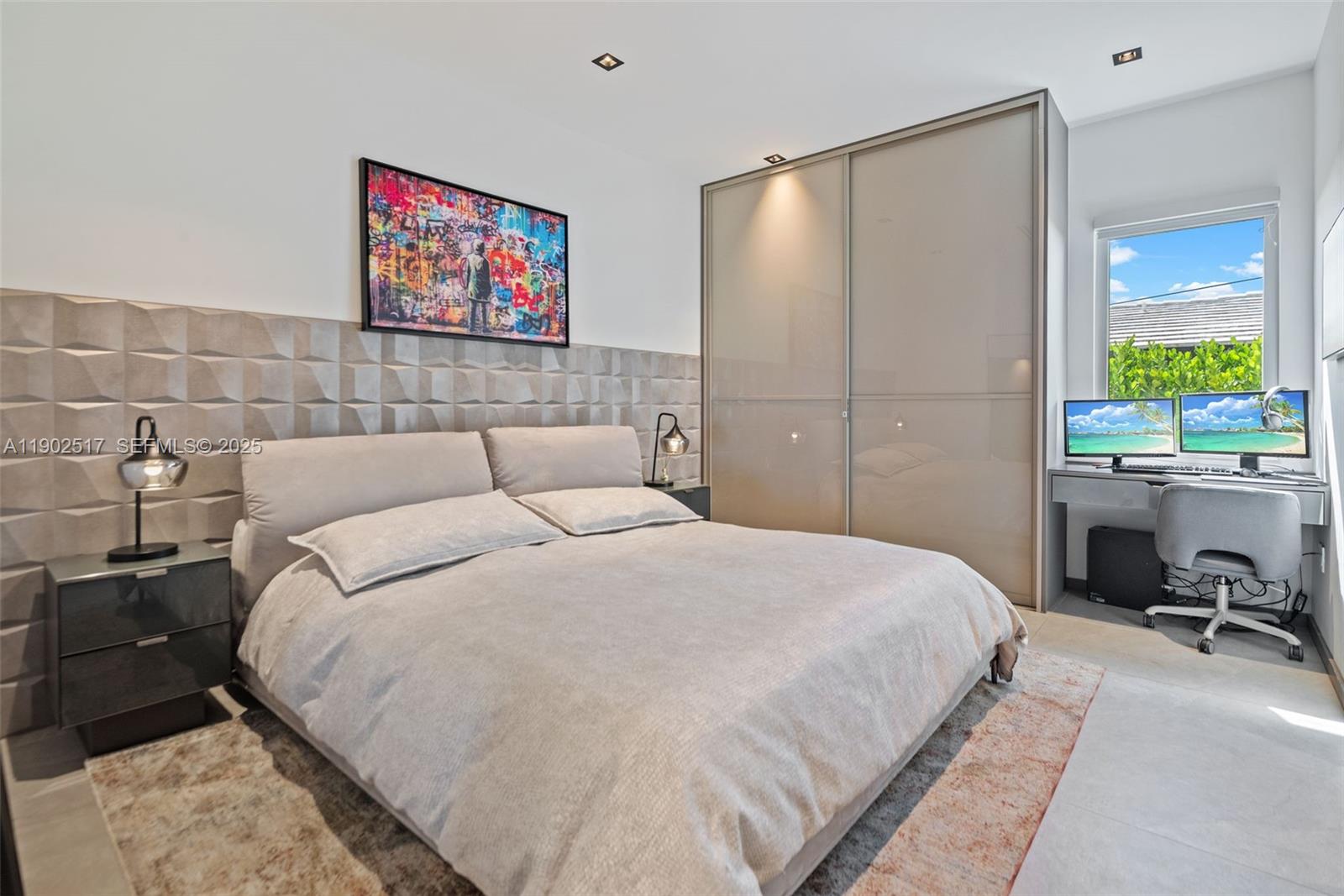 655 Layne Boulevard Hallandale Beach, FL 33009 - Photo 18 of 46 a bedroom with a bed and a desk