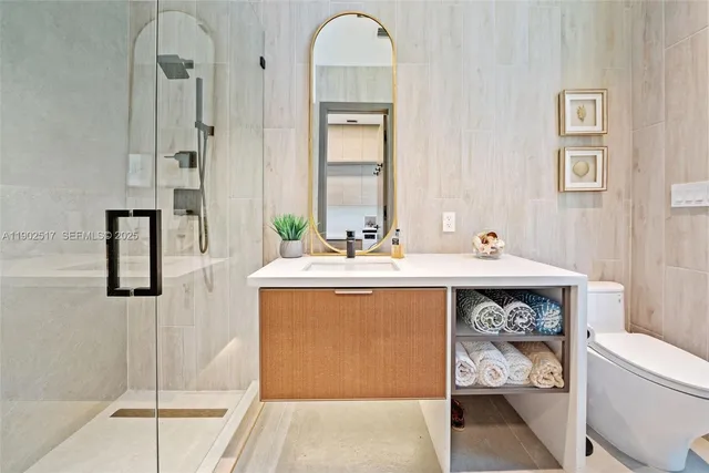 a utility room with sink dryer and washer
