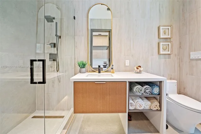 a utility room with sink dryer and washer