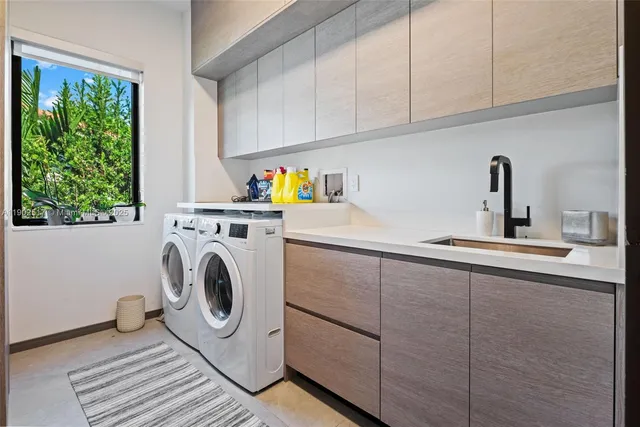 a kitchen with stainless steel appliances granite countertop a sink a stove and a wooden cabinets
