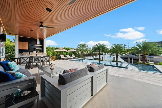 a view of a patio with swimming pool table and chairs