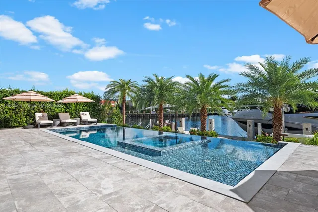 a view of a living room and a swimming pool