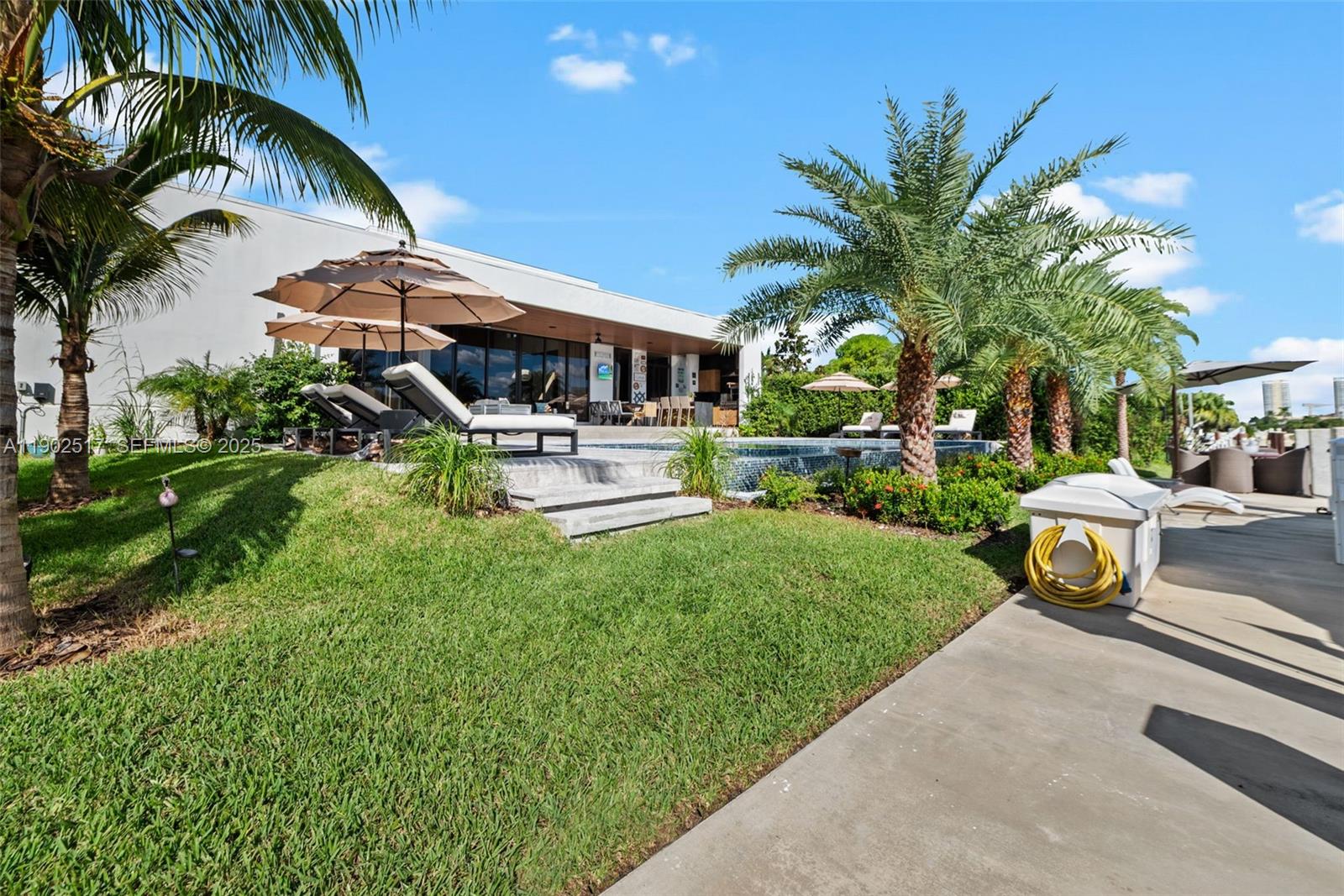 655 Layne Boulevard Hallandale Beach, FL 33009 - Photo 35 of 46 a view of a house with backyard and sitting area