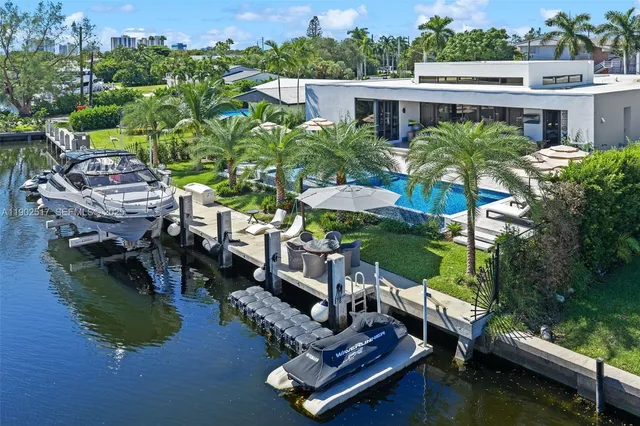 a view of a lake with lawn chairs