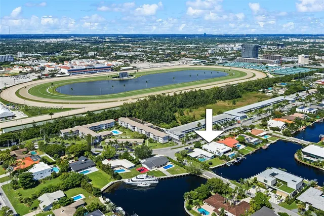 a view of a lake with a table and chairs