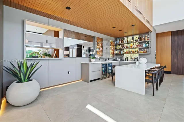 a kitchen with sink and cabinets