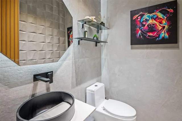 a bathroom with a toilet and a sink