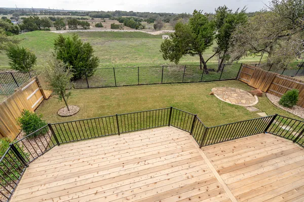 a view of a balcony with wooden floor