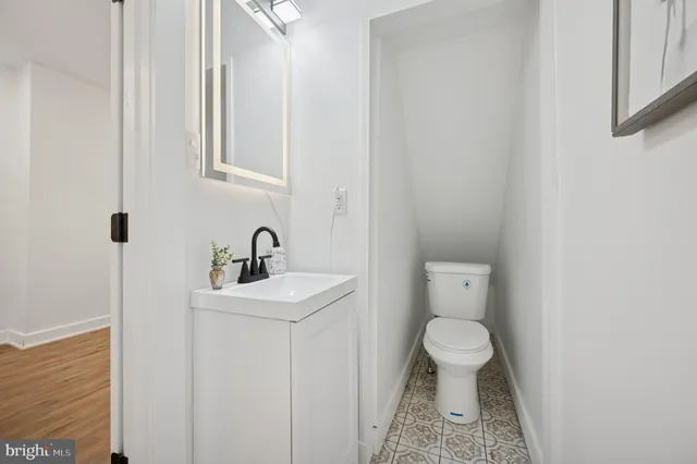 a kitchen with refrigerator cabinets and a sink