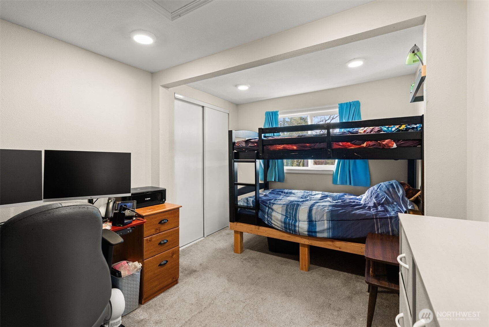 3306 Romane Road Raymond, WA 98577 - Photo 12 of 25 a bedroom with furniture and a flat screen tv