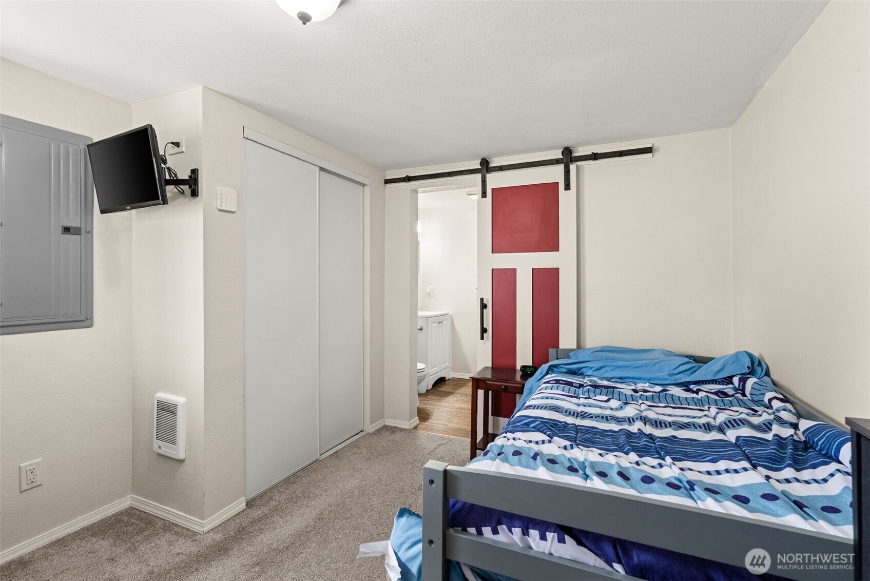 3306 Romane Road Raymond, WA 98577 - Photo 14 of 25 a bedroom with a bed and a flat screen tv