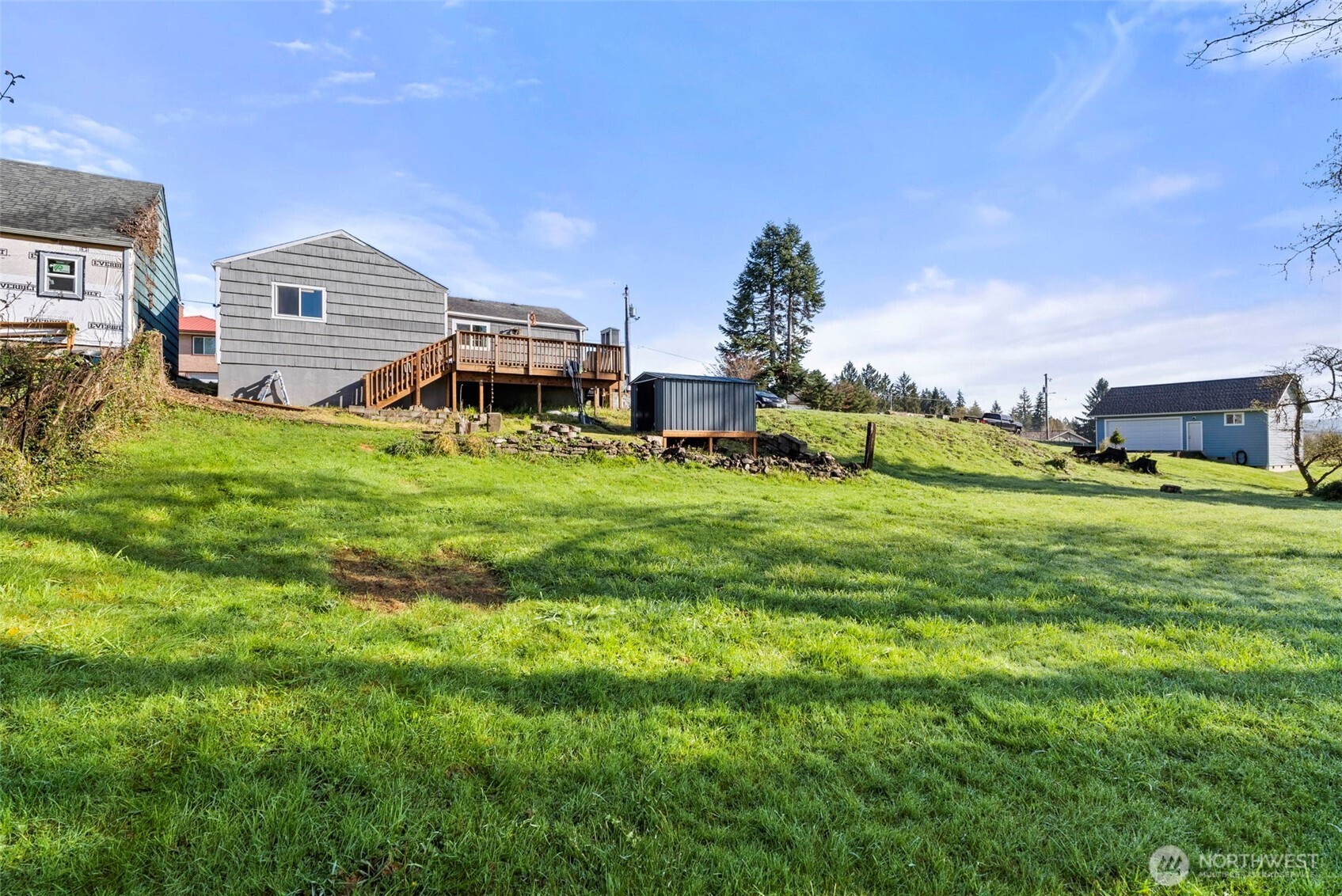 3306 Romane Road Raymond, WA 98577 - Photo 21 of 25 a front view of a house with a garden and plants