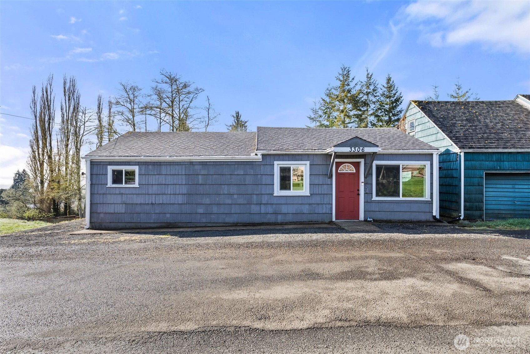 3306 Romane Road Raymond, WA 98577 - Photo 25 of 25 a front view of a house with a garden