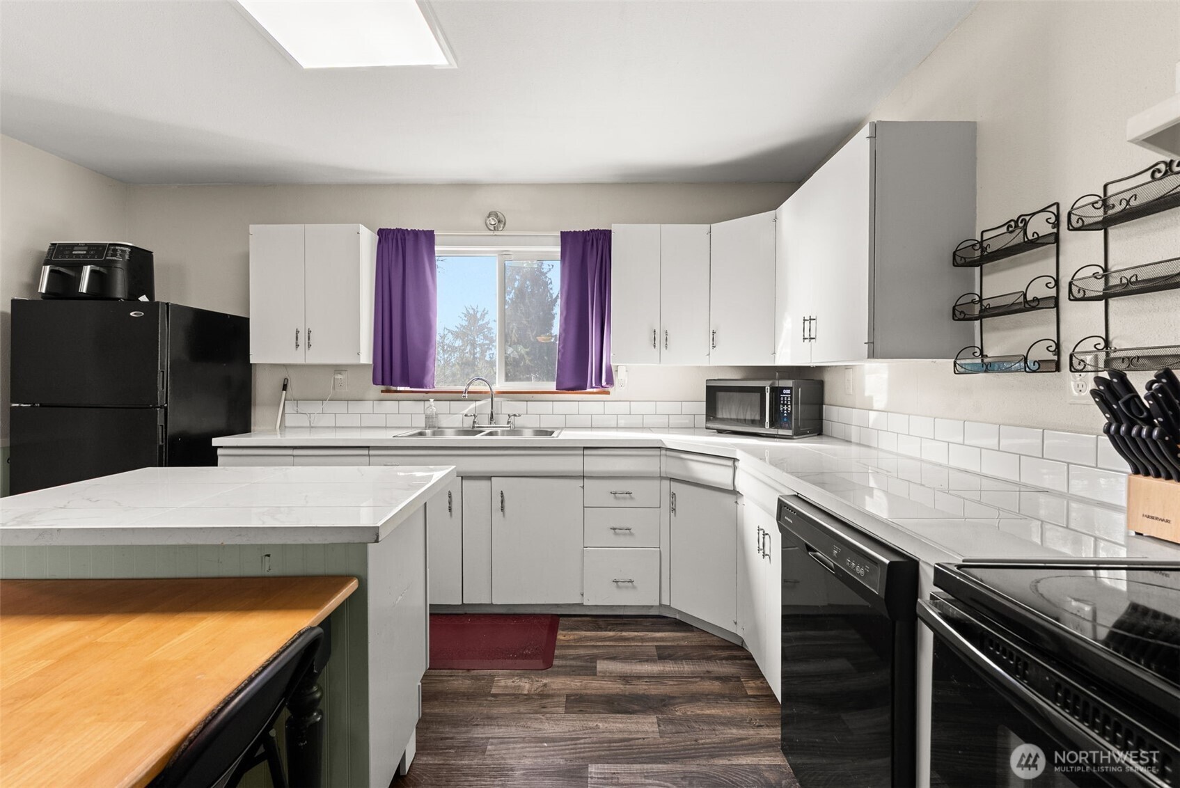 3306 Romane Road Raymond, WA 98577 - Photo 8 of 25 a kitchen with a sink stove and refrigerator