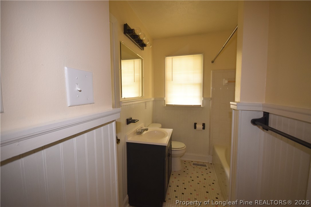 108 South 6th Street Spring Lake, NC 28390 - Photo 7 of 20 a bathroom with a sink and a mirror