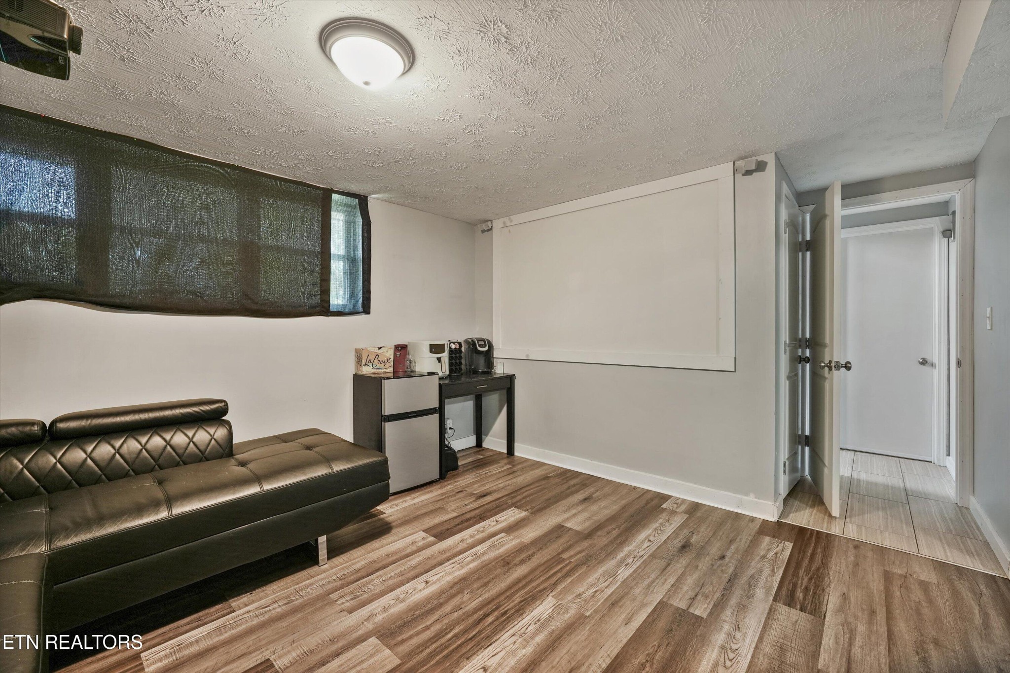 7613 Fall Wind Court Powell, TN 37849 - Photo 27 of 38 a living room with furniture and a wooden floor