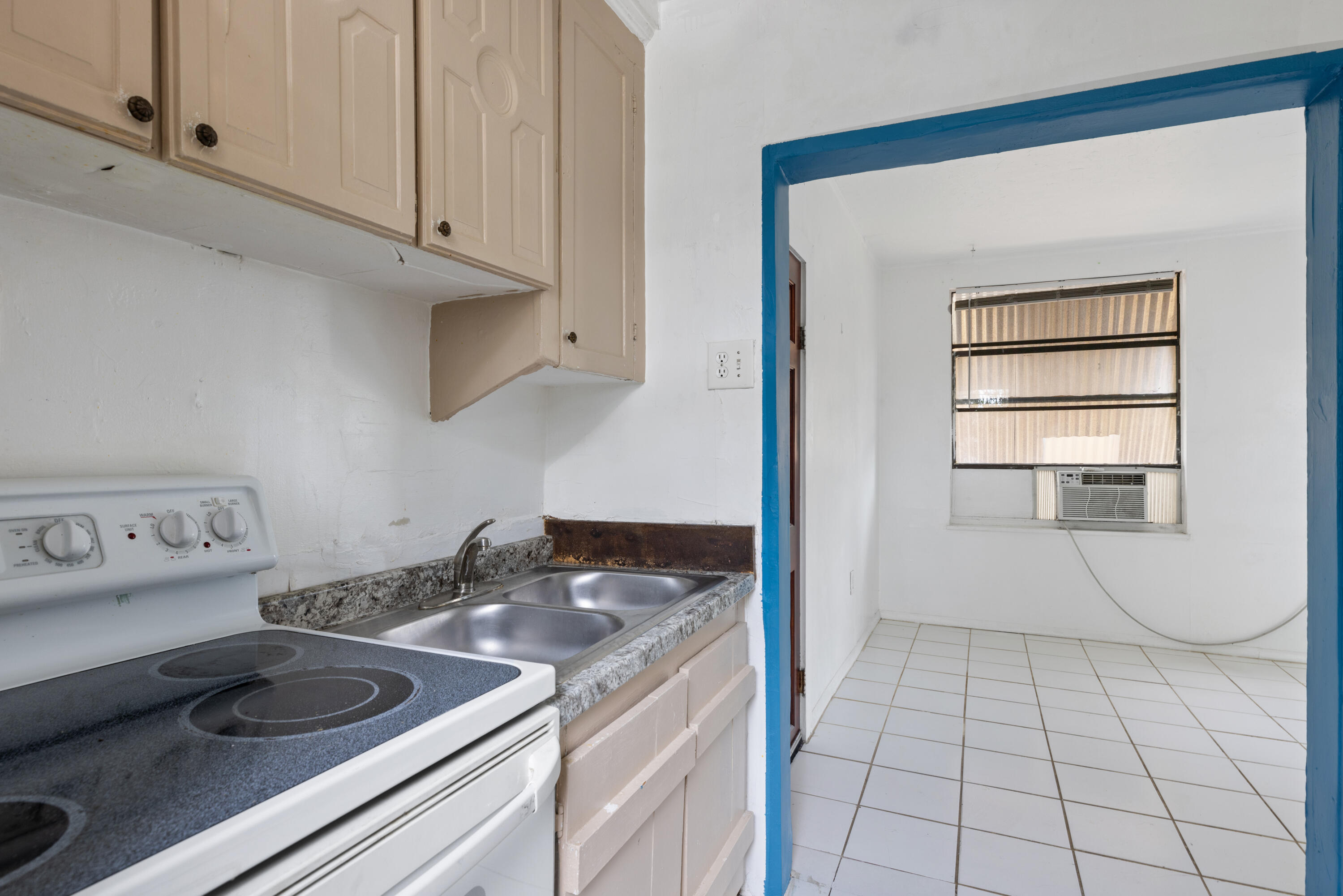 902 Boston Avenue Fort Pierce, FL 34950 - Photo 14 of 34 a kitchen with a sink and cabinets