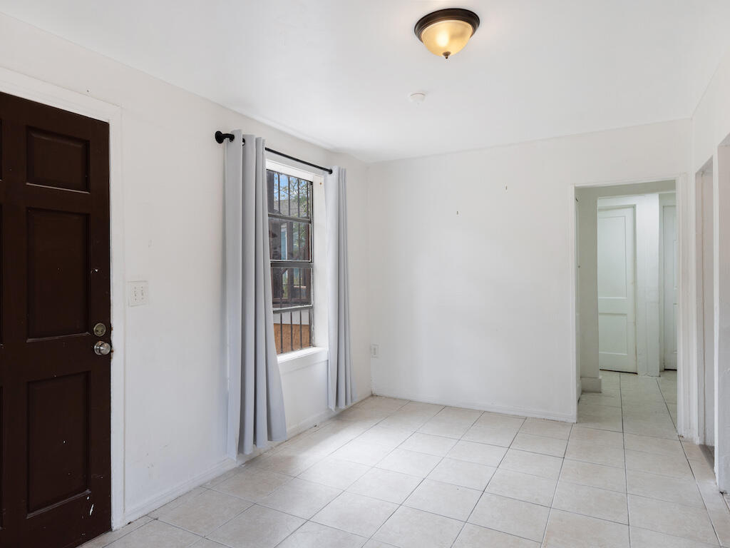 902 Boston Avenue Fort Pierce, FL 34950 - Photo 17 of 34 an empty room with closet and windows