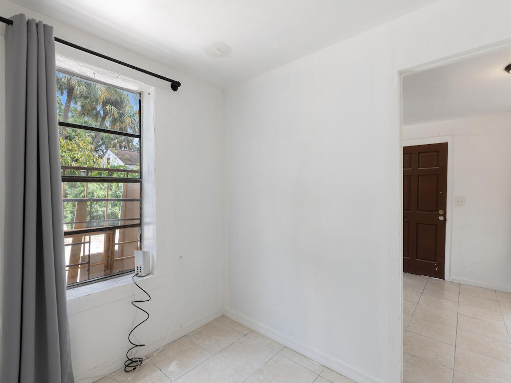 902 Boston Avenue Fort Pierce, FL 34950 - Photo 23 of 34 a view of an empty room with a window