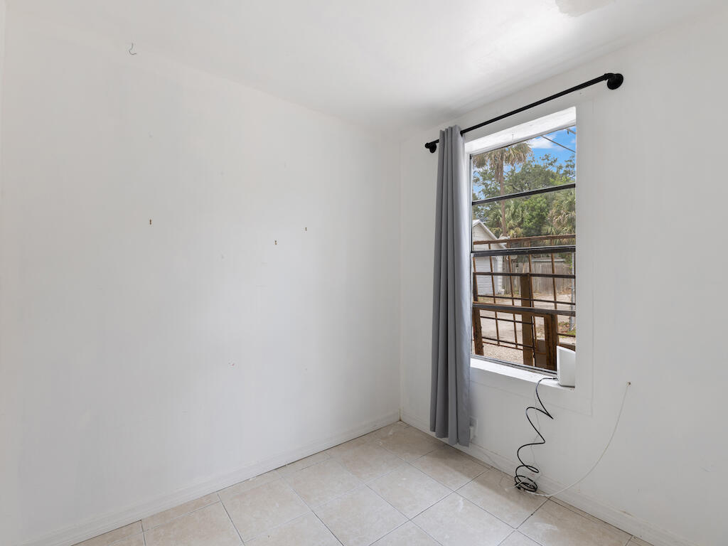 902 Boston Avenue Fort Pierce, FL 34950 - Photo 24 of 34 a view of an empty room with a window