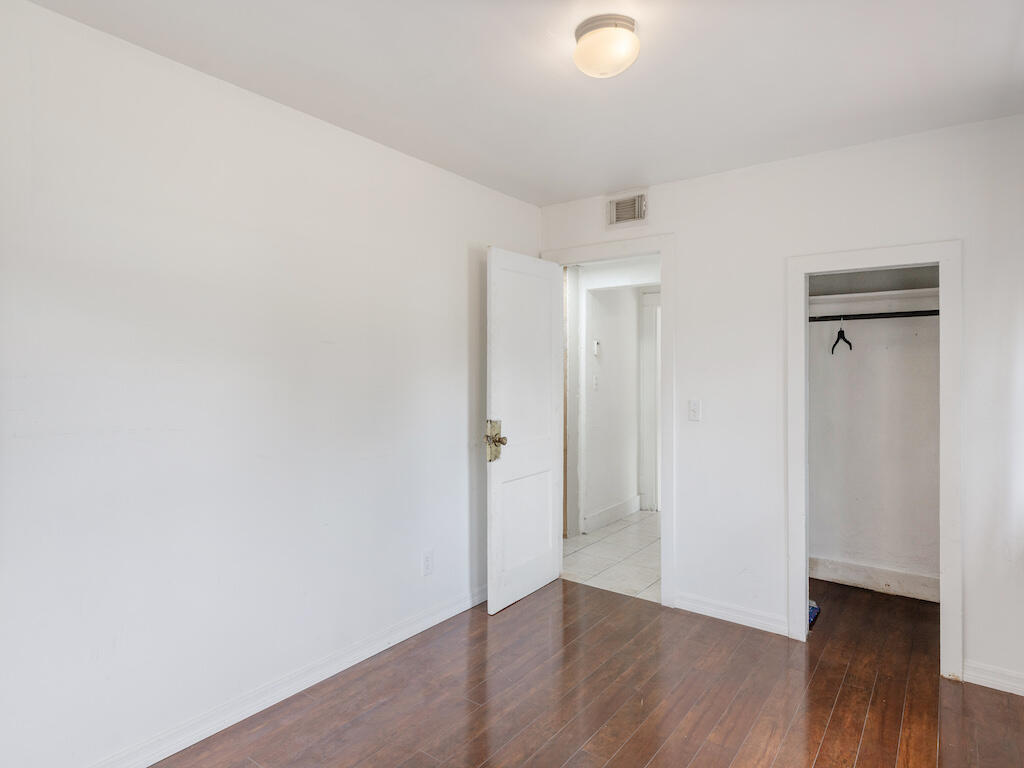 902 Boston Avenue Fort Pierce, FL 34950 - Photo 25 of 34 a view of an empty room and wooden floor
