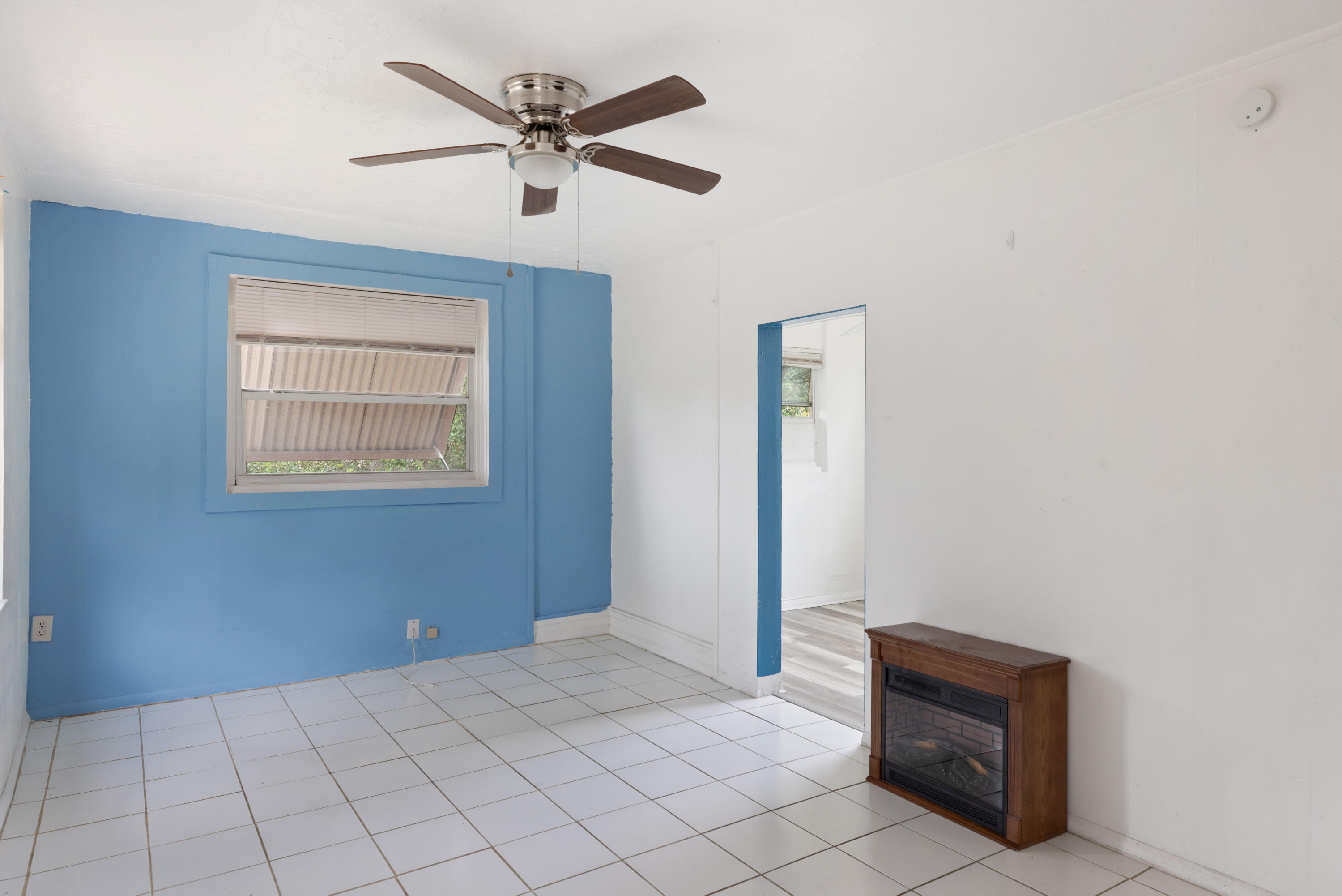 902 Boston Avenue Fort Pierce, FL 34950 - Photo 6 of 34 a view of room with cabinet and ceiling fan