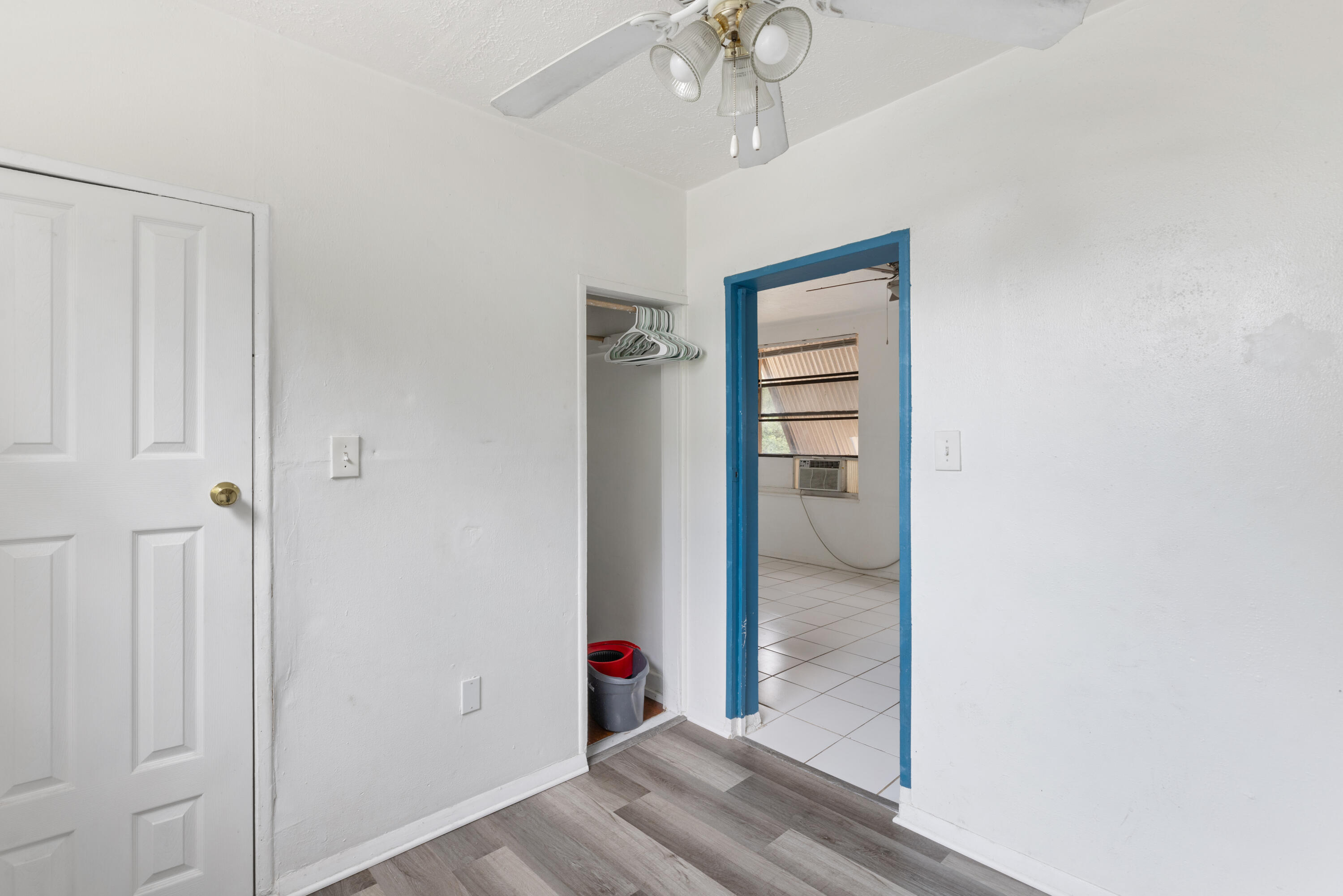 902 Boston Avenue Fort Pierce, FL 34950 - Photo 10 of 34 a view of a hallway with wooden floor and closet