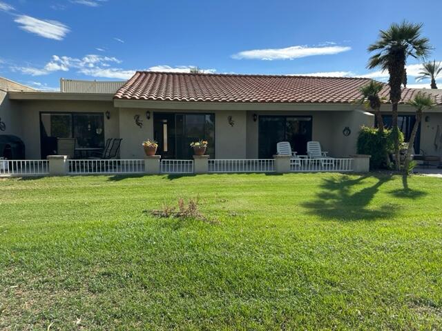 41450 Inverness Way Palm Desert, CA 92211 - Photo 15 of 19 a view of a house with sitting area and swimming pool