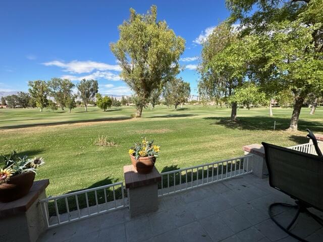41450 Inverness Way Palm Desert, CA 92211 - Photo 17 of 19 a view of lawn chairs and iron fence