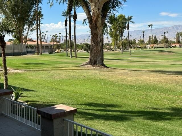 a view of a golf course with a lake view