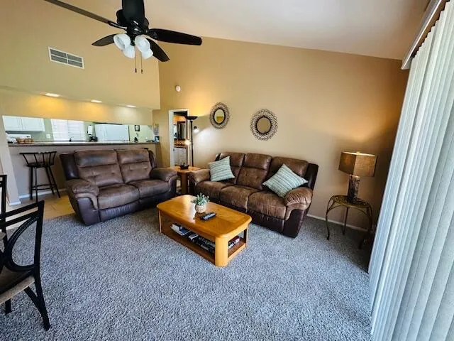 a living room with furniture and a rug