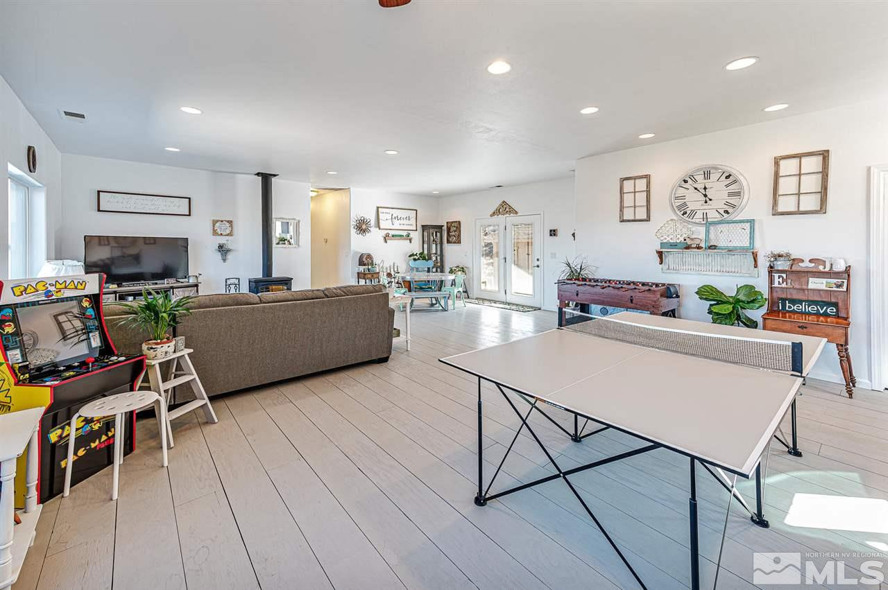 3650 Palisade Road Reno, NV 89521 - Photo 17 of 25 a living room with furniture and a wooden floor