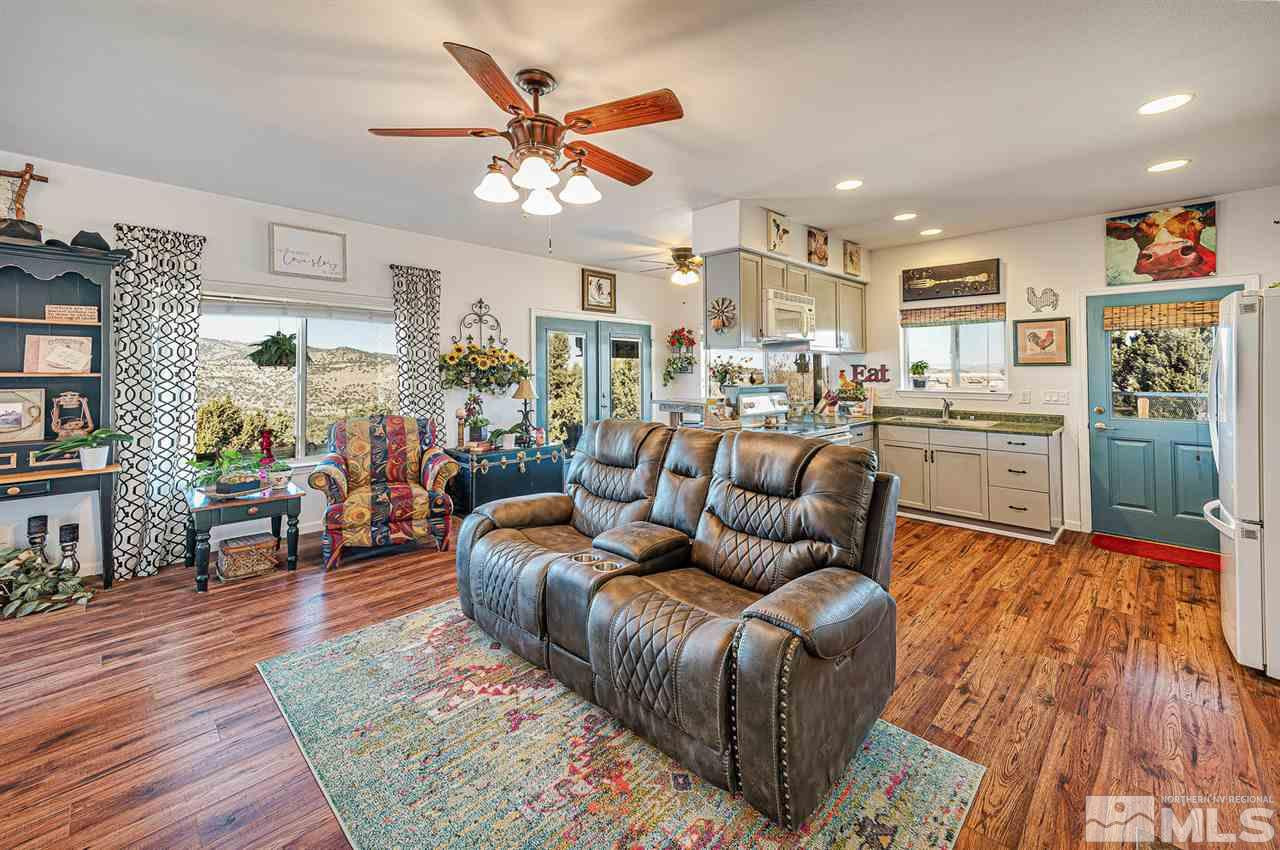 3650 Palisade Road Reno, NV 89521 - Photo 23 of 25 a living room with furniture kitchen view and a wooden floor