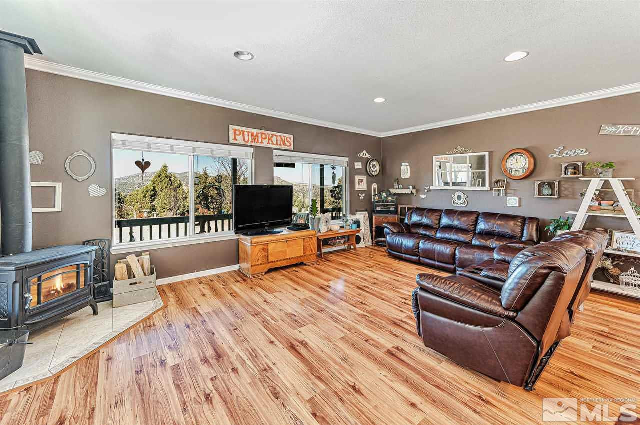 3650 Palisade Road Reno, NV 89521 - Photo 8 of 25 a living room with furniture and a flat screen tv