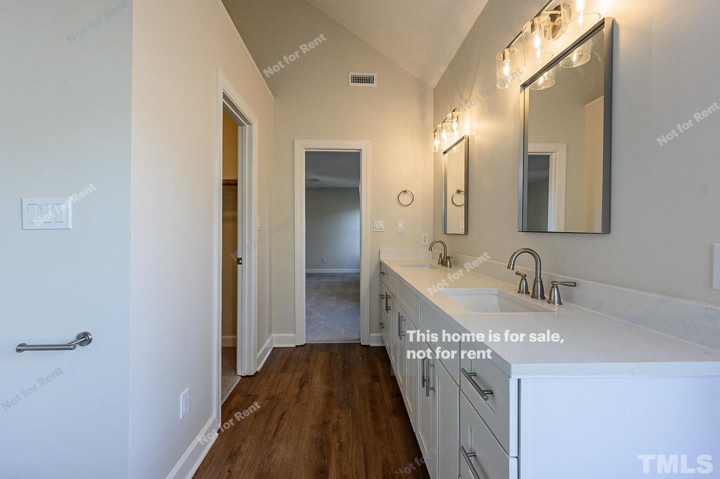 203 Parkgate Drive Cary, NC 27519 - Photo 20 of 31 a bathroom with a sink a vanity and a mirror