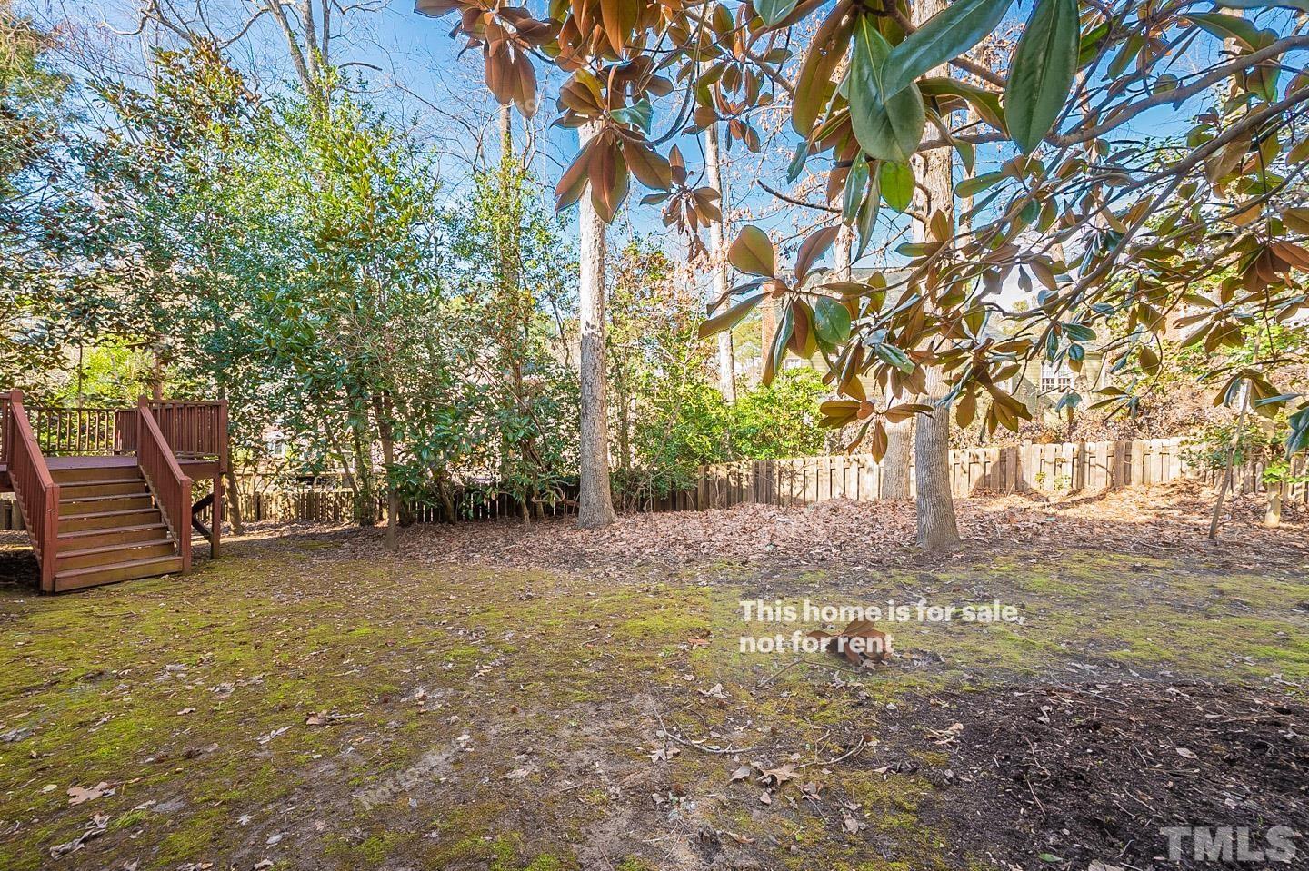 203 Parkgate Drive Cary, NC 27519 - Photo 30 of 31 a view of a yard with some trees
