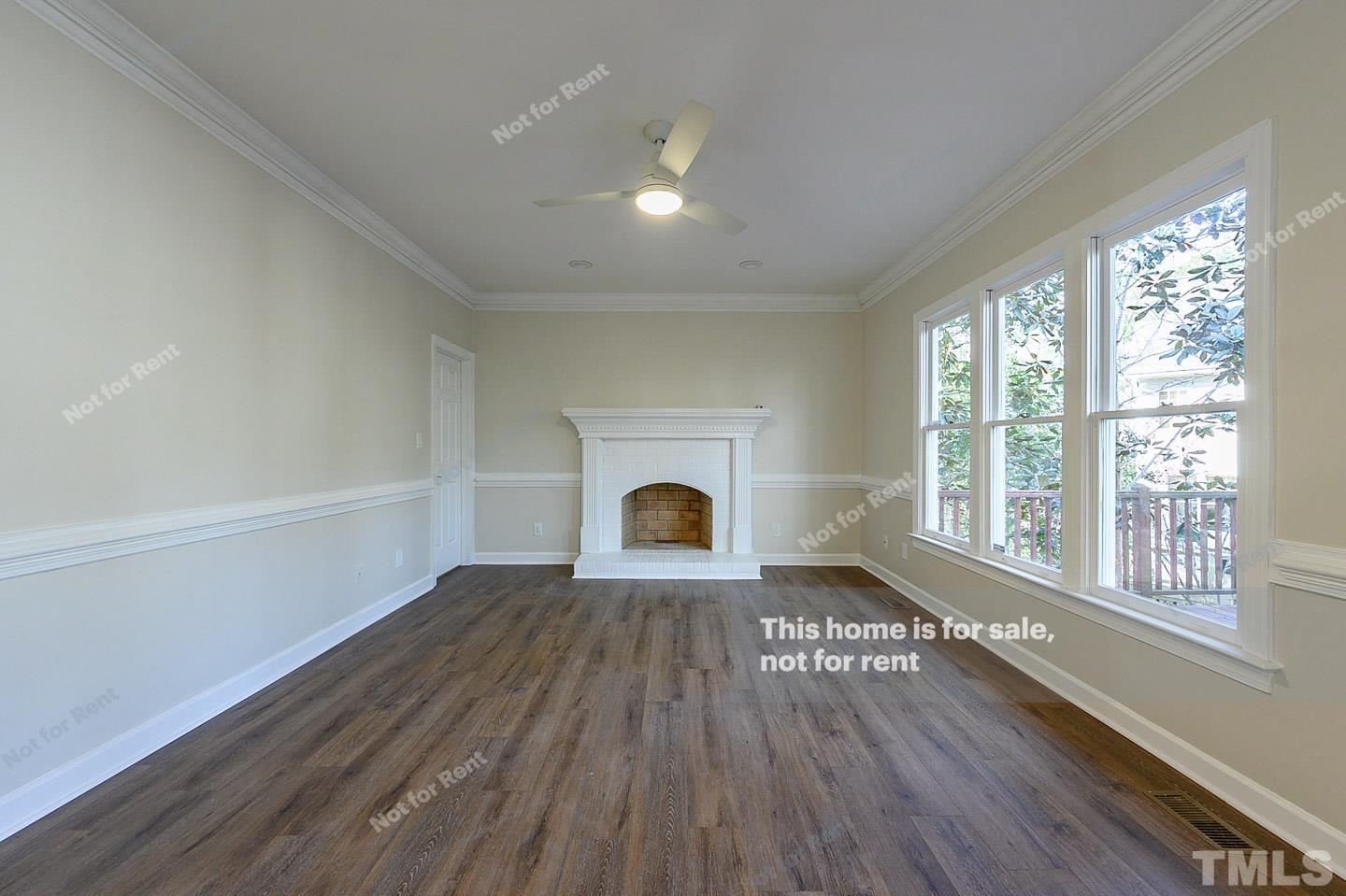 203 Parkgate Drive Cary, NC 27519 - Photo 3 of 31 a view of livingroom with furniture a fireplace and wooden floor