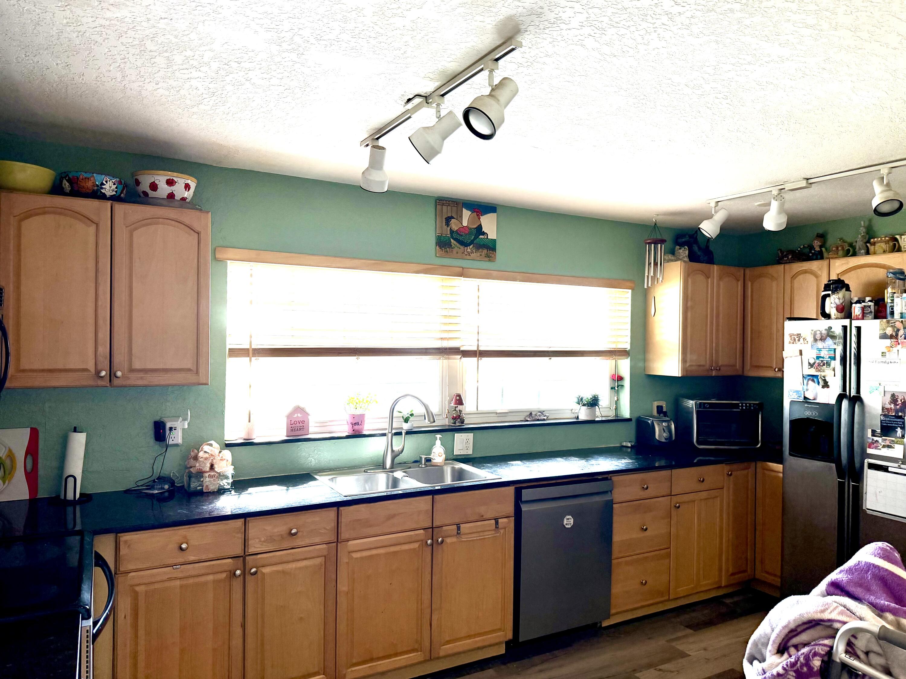 1371 Southwest 4th Street Boca Raton, FL 33486 - Photo 12 of 19 a kitchen with a sink and a large window