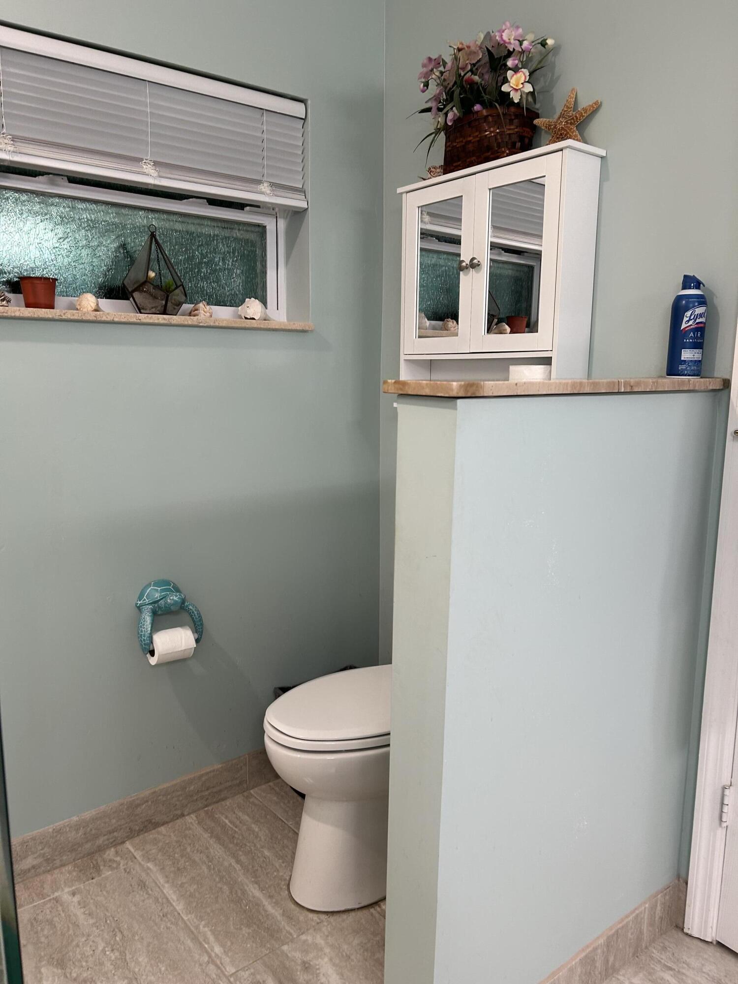 1371 Southwest 4th Street Boca Raton, FL 33486 - Photo 16 of 19 a bathroom with a toilet and a sink