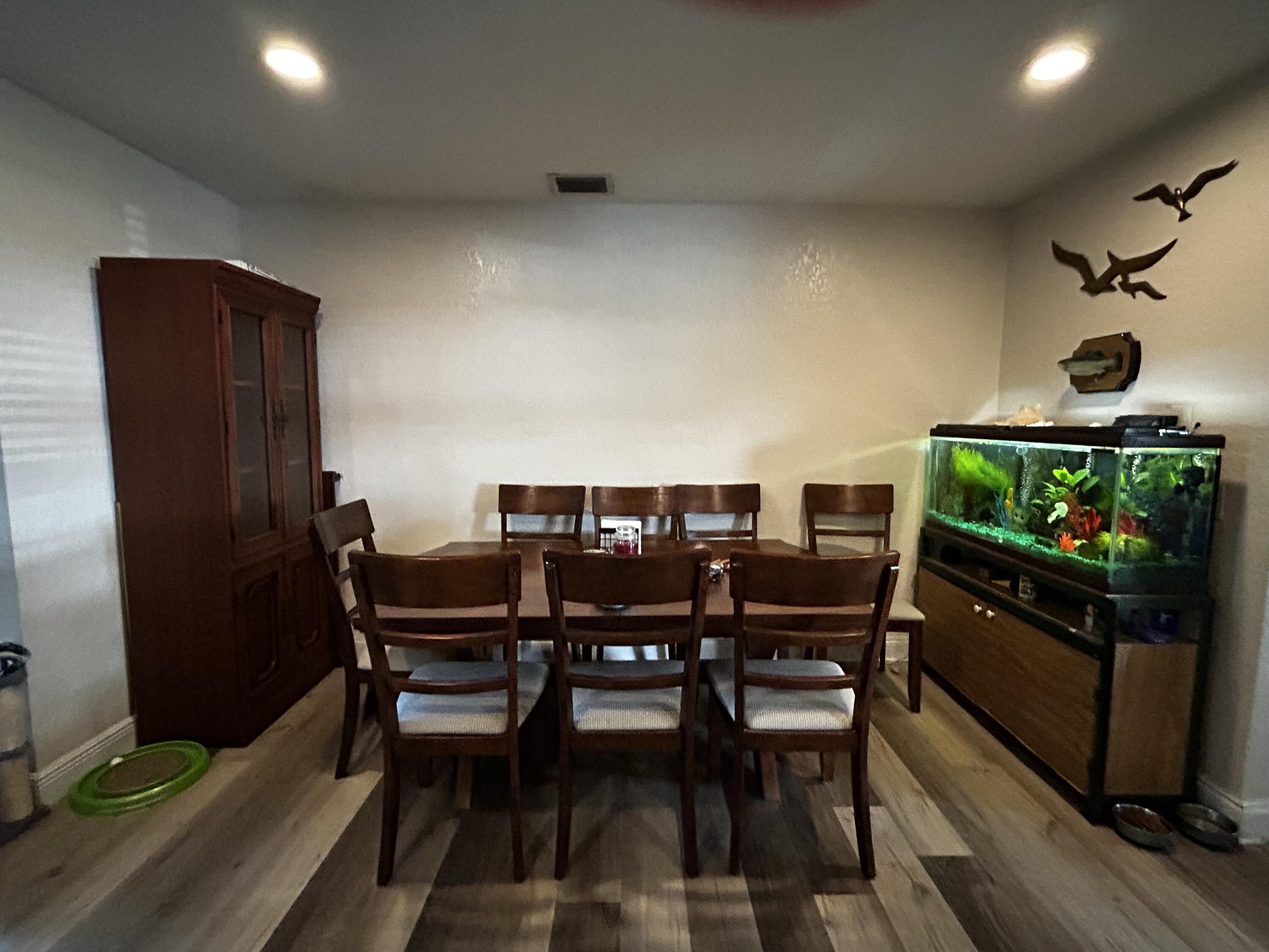 1371 Southwest 4th Street Boca Raton, FL 33486 - Photo 3 of 19 a view of a dining room with furniture and wooden floor