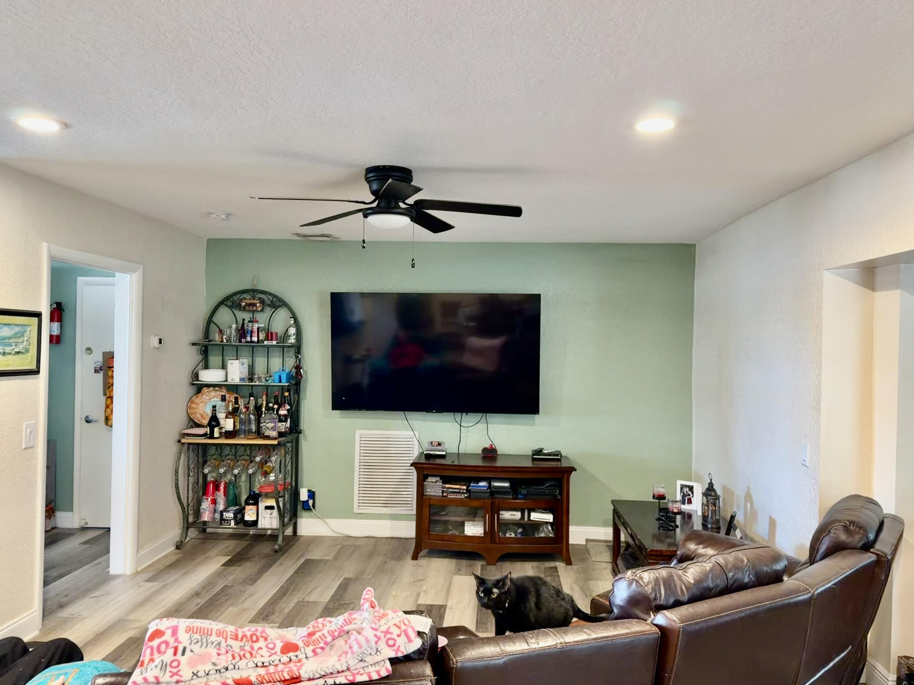 1371 Southwest 4th Street Boca Raton, FL 33486 - Photo 5 of 19 a living room with furniture and a flat screen tv
