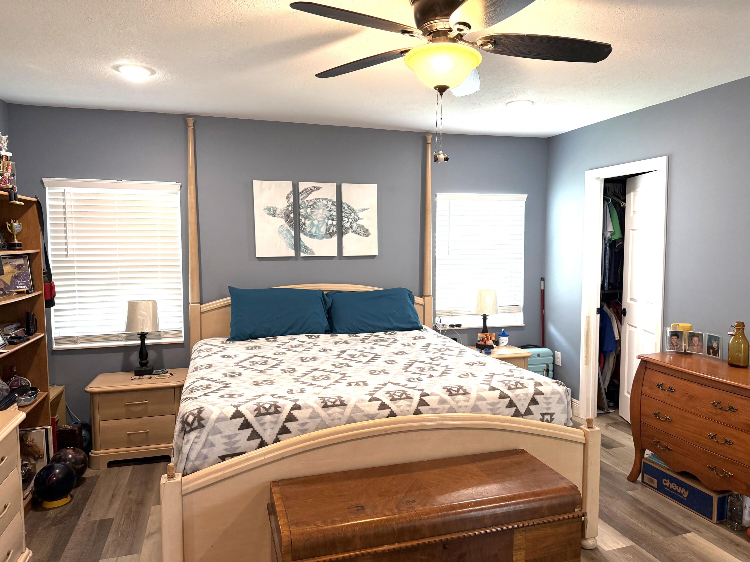 1371 Southwest 4th Street Boca Raton, FL 33486 - Photo 7 of 19 a bedroom with a bed and wooden floor