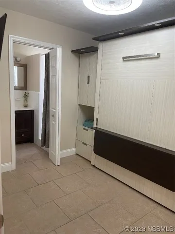 a bathroom with a sink vanity and mirror