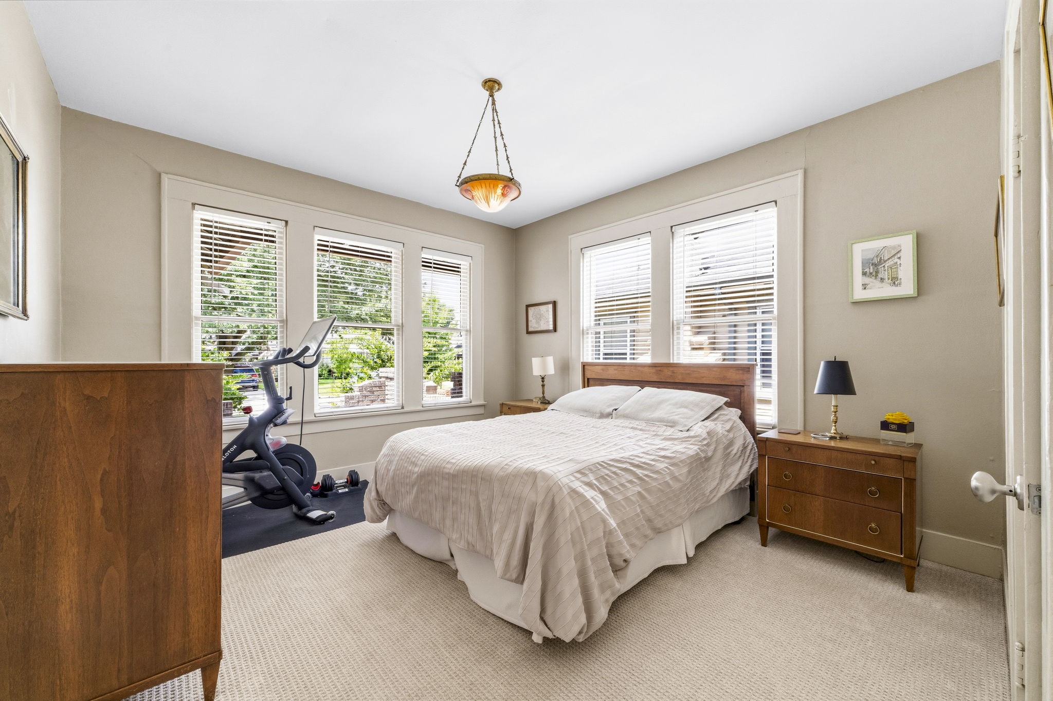 1521 Kipling Street Houston, TX 77006 - Photo 30 of 35 This cozy bedroom features large windows for natural light, a comfortable bed, and ample space for furniture. The room also accommodates a small exercise area, perfect for convenience.