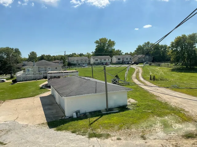 a view of a garden with a patio