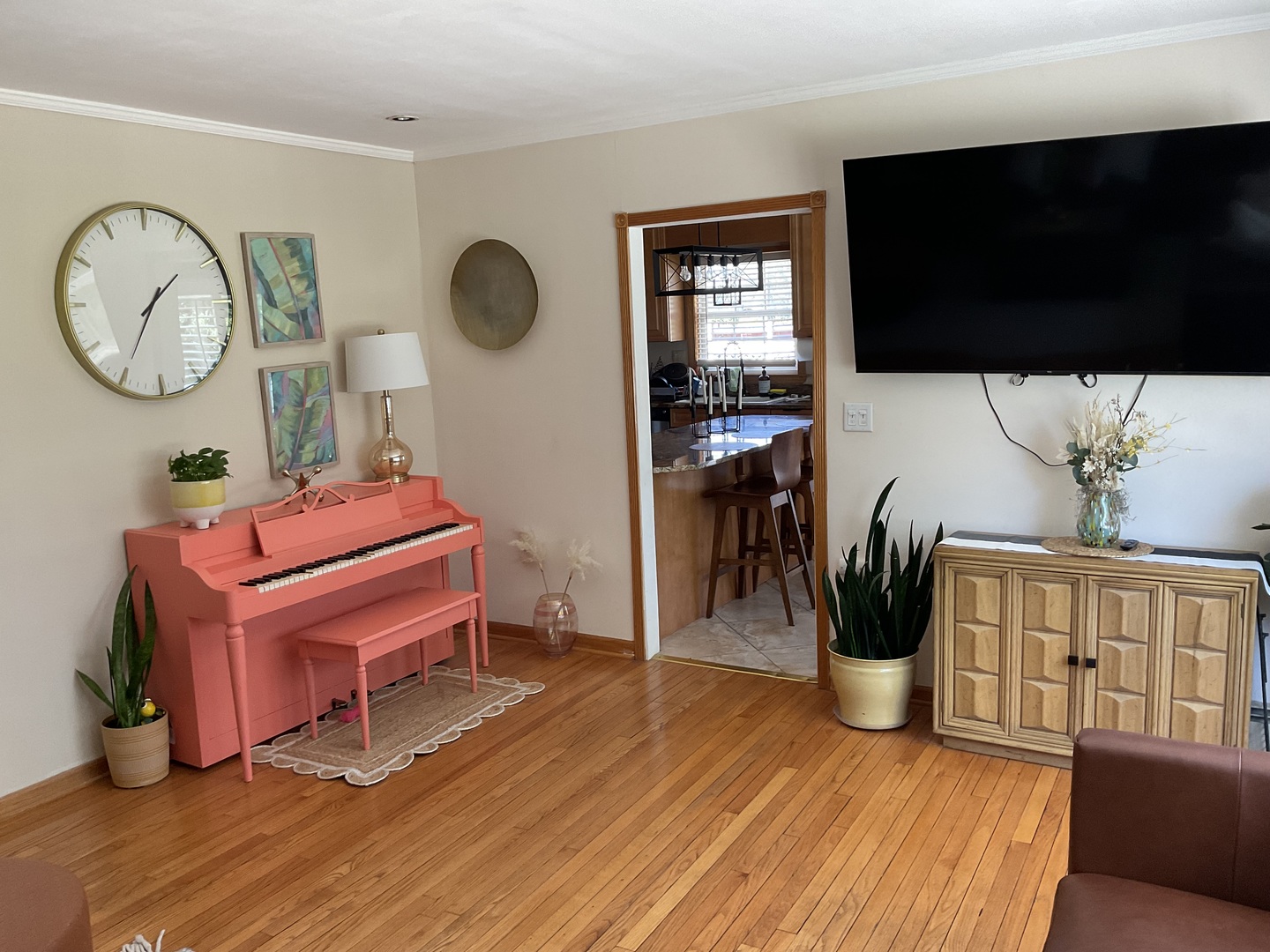 2741 223rd Street Chicago Heights, IL 60411 - Photo 13 of 41 a living room with furniture a flat screen tv and a wooden floor
