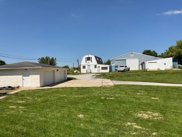 a view of empty room with wooden walls