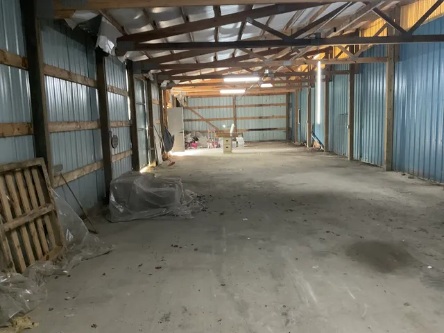 a view of a hall with wooden floor