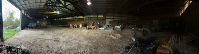 a view of a livingroom with wooden floor and a window